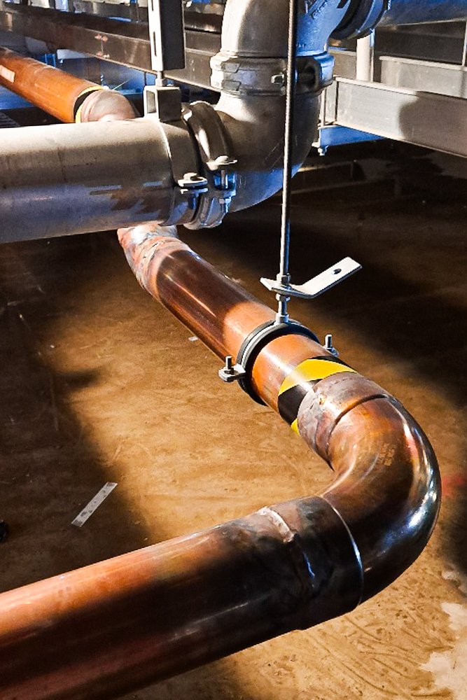 Close up large brazed copper pipe.
