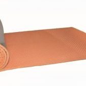 FLEXI WRAP-Insulation-1 Flexicell Flexiwrap noise reducing acoustic pipe insulation roll being rolled out. Orange foam on the inside to reduce sound with metallic silver outside.