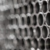 Piping-System-Hero-STEELFIX Stainless Steel STEELFIX stainless steel piping system pipe close all layered over each other.